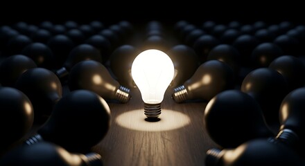 Fototapeta premium Glowing light bulb among dark bulbs idea innovation