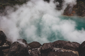 Thick Steam Rising from Natural Volcanic Onsen Pool in Japan