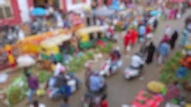 Bokeh view of street vegetable market in Bangalore, India. Blurred background footage.
