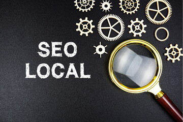 Seo Local text message with magnifying glass on black background