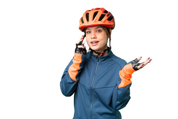 Young cyclist girl over isolated chroma key background keeping a conversation with the mobile phone...