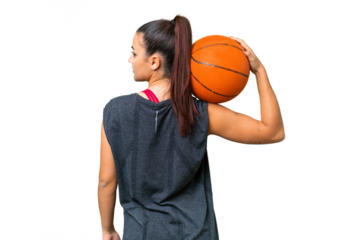 Young beauty woman over isolated chroma key background playing basketball in back position