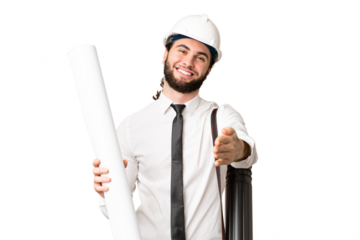 Young architect man with helmet and holding blueprints over isolated chroma key background shaking hands for closing a good deal