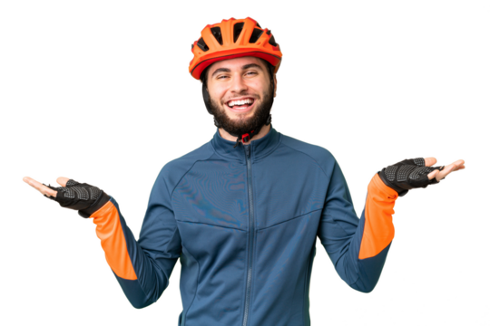Young cyclist man over isolated chroma key background with shocked facial expression