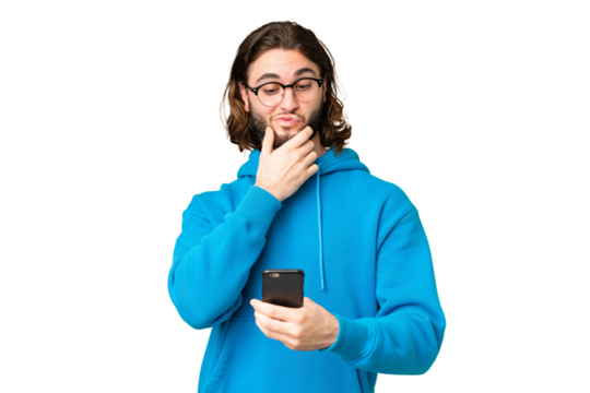 Young handsome man over isolated chroma key background thinking and sending a message