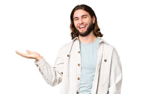 Young handsome man over isolated chroma key background holding copyspace imaginary on the palm to insert an ad