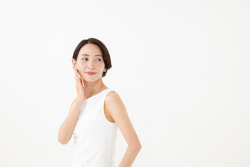 Naklejka premium 頬に手をあてるミドル女性