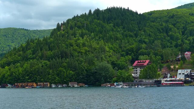 view of lake and hills with forest is beautiful, summer landscape on a bright and sunny day
