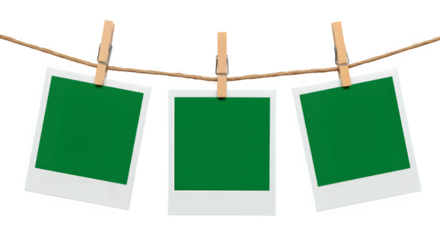 Three blank Chroma key Green format Polaroid photo frames clipped to a rope with wooden pegs, isolated on white or transparent background. PNG