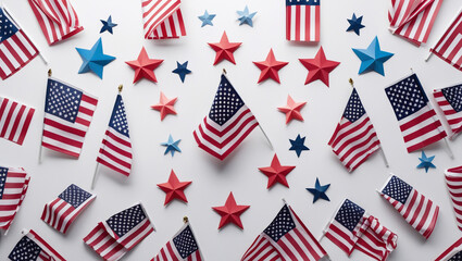 Obraz premium Overhead arrangement of american flags and star decorations on a white surface, perfect for celebrating patriotic holidays like independence day, memorial day, and other national events