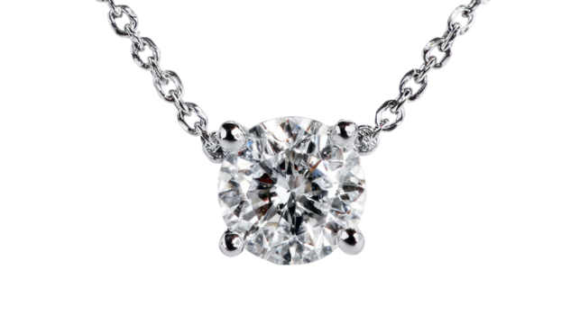 Diamond solitaire necklace with silver chain shining brightly isolated, transparent background