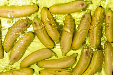 Mini Bananas in Clear Water with Splash. Aesthetic Fruit Scene.