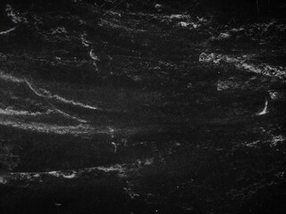 Old black paper texture with white scratches. Texture grunge black board with chalk, perfect for...