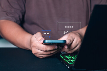 Men hand using smartphone typing Live chat chatting and social network concepts, chatting conversation working at home in chat box icons pop up. Social media marketing technology concept.