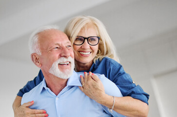 Happy active senior couple having fun at home. Portrait of an elderly couple together