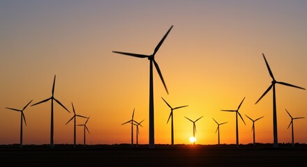Silhouetted Wind Turbines at Sunset Over a Field