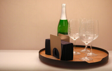 Elegant Serving Tray with Sparkling Beverage and Wine Glasses