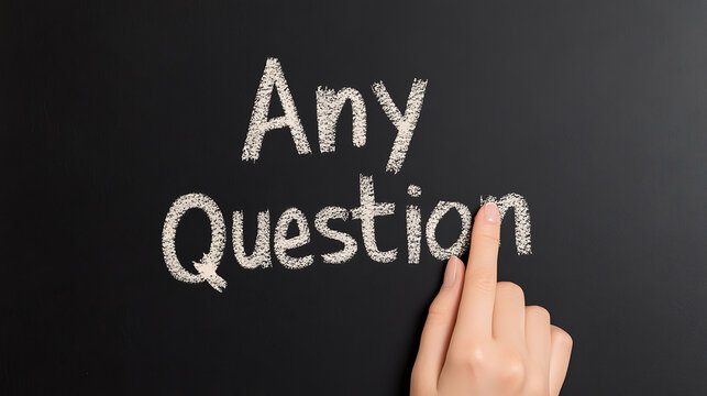 Hand pointing to the phrase "Any Question" written in white chalk on a dark background, idea concept, asking queries, problem solving, conceptual.