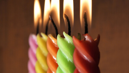 Christmas New Year decoration with lit colorful curly candles