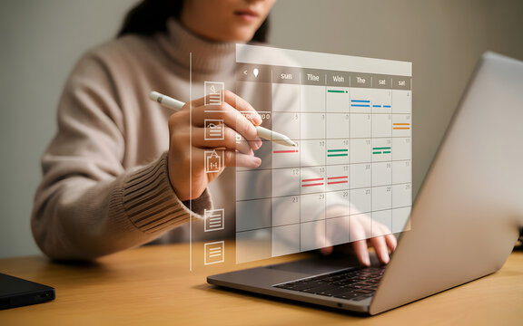 Schedule Mastery: A Focused Individual Engages in Project Planning on Laptop in Contemporary Setting, highlighting the synergy of efficiency and modernity.