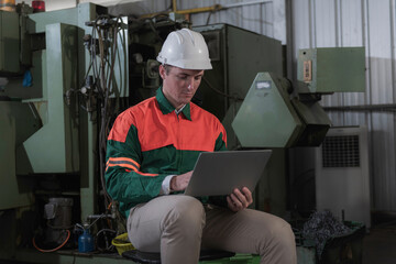 industrial workers at work. industrial workers in factory. portrait of a worker. worker wear helmet in factory.