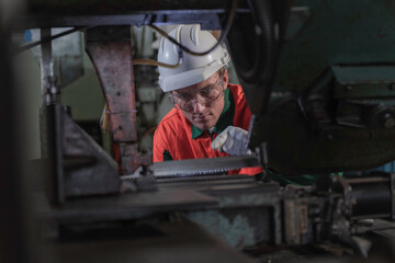 industrial workers at work. industrial workers in factory. portrait of a worker. worker wear helmet in factory.
