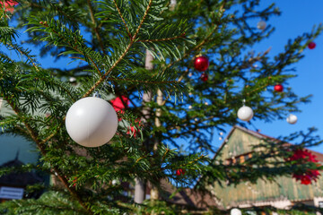 Christmas tree with ornaments on a sunny day