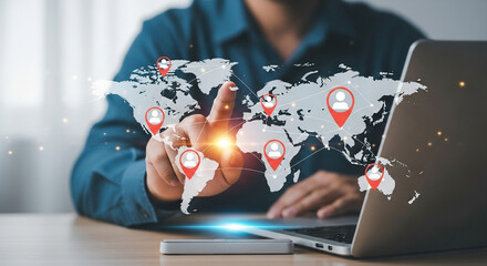 Person interacting with a global network of connections on a holographic world map