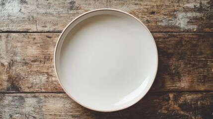 Empty white plate on rustic wooden table