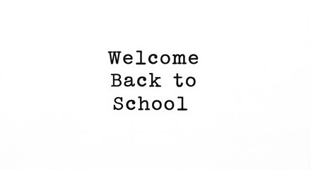 A simple welcome back to school message in typewriter font on a plain white background image design