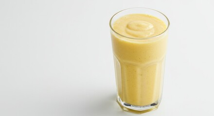 Creamy Mango Smoothie in Tall Glass, Isolated on White Background