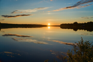 beautiful sunset at a lake in Finland in midsummer.