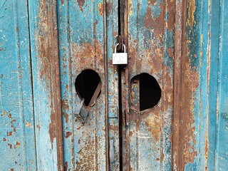 A premise locks zinc folding door even though the premise is idle and unused using padlock