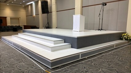 Modern Multi-Level Stage with Podium, Professional Audio Visual Setup, Elegant Conference Room