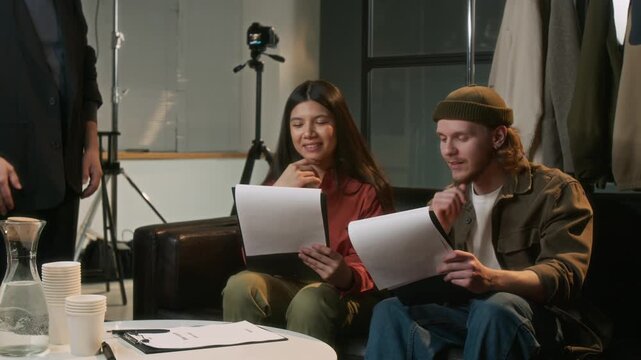 Filming director inviting actress to go on set for her acting audition for role, her colleague cheering her up