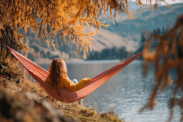 Relaxing Woman in Hammock by Serene Autumn Lake
