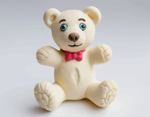 The bear is sitting in a classic pose with its limbs slightly spread and a gentle, friendly expression. Its body has a distinct, wrinkled or fibrous texture, giving it a handcrafted, slightly rustic 