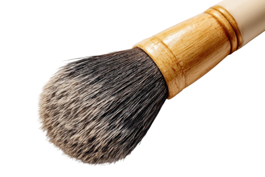 Close-up of a shaving brush head, featuring a dense, slightly tapered bristle head, with a light beige/cream handle, and a light brown/tan bamboo-like section.  The bristles appear dark gray