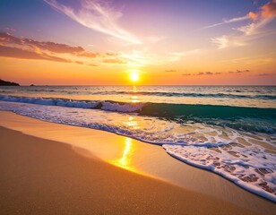 Obraz premium Breathtaking sunset over the ocean with waves gently washing the sandy beach