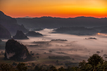 Sunshine in the morning mist at Phu Lang Ka, Phayao, Thailand.