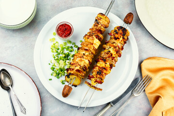 Grilled vegetable bacon kebabs, flat lay.
