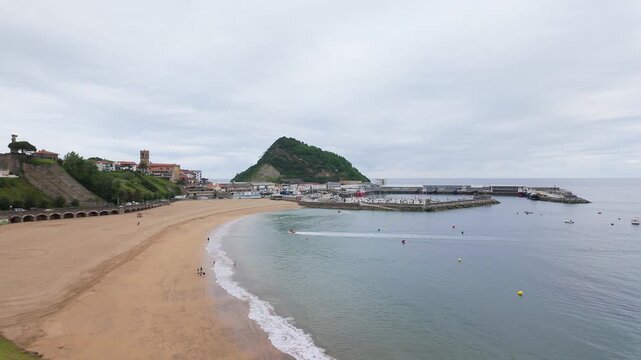 Large beach in the town of Getaria on the edge of the sea in northern Spain, Basque Country.