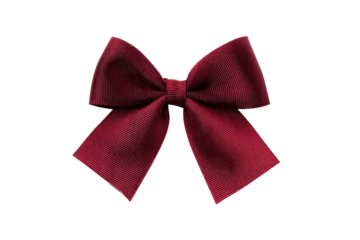 Close-up of a rich maroon ribbon bow.  A symmetrical,  formal bow, with  textured surface and sharp edges