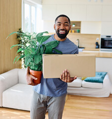Young black man guy moving into a new modern house, carrying boxes and arriving home. Happy,...