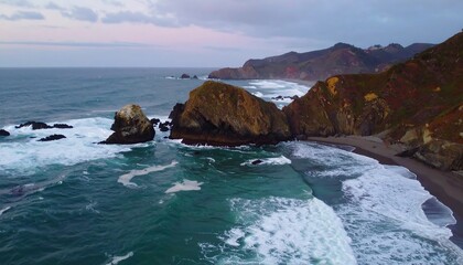 Obraz premium Dramatic Coastal Cliffs and Ocean Waves at Sunset
