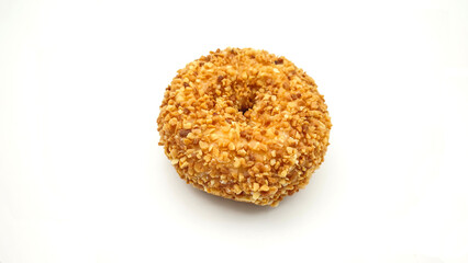 Beautiful doughnuts covered in chopped nuts glaze on white background.