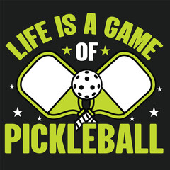 Life is a Game of Pickleball A playful design celebrates the lively sport of pickleball, showcasing paddles and a ball with the message Life is a Game of Pickleball, perfect for sports enthusiasts.