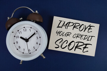Improve Your Credit Score text with alarm clock on blue background