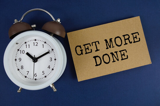 Get More Done text with alarm clock on blue background