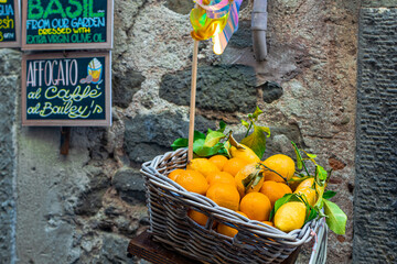 A photo of a basket of oranges